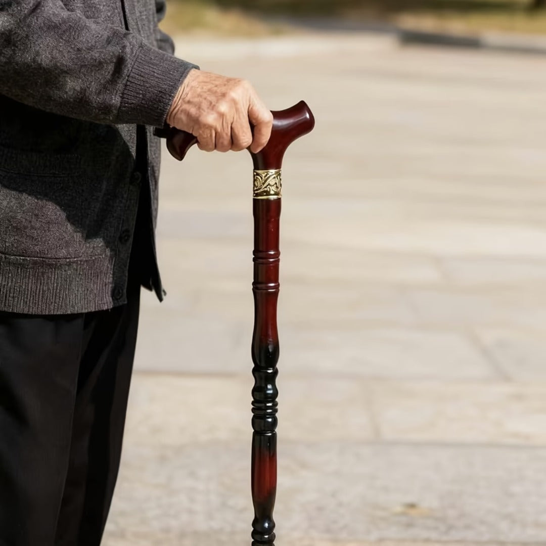 Ornate Collar Derby Walking Cane held in use, showing the gold collar