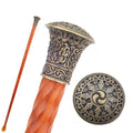 Brass crown knob walking cane in orange wood, 95cm