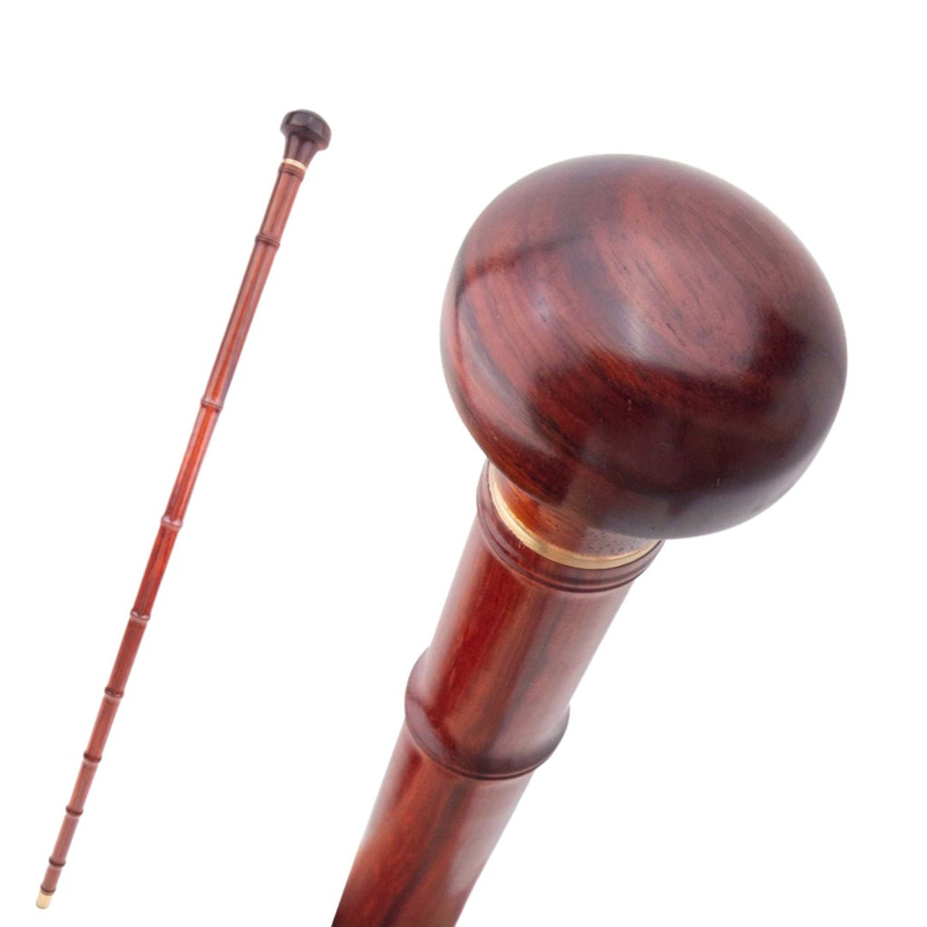 Red bamboo joint wooden walking cane full length view