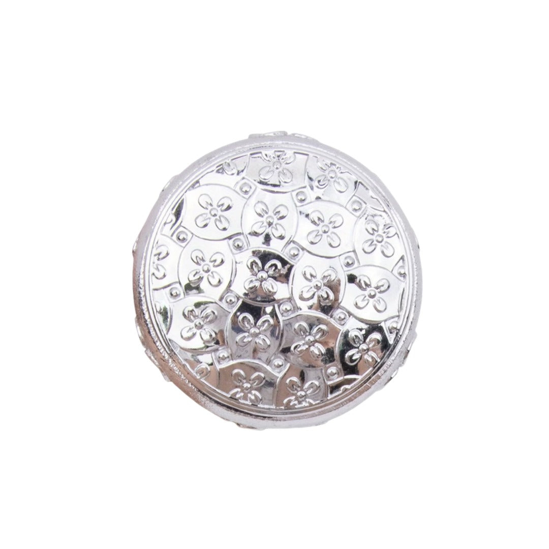 Embossed silver flower knob top detail